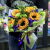 Букет из подсолнухов, ирисов и эустом в Москве